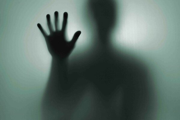 A stranger s hand in the shadow