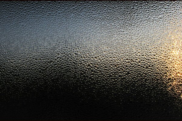 Glare of light on wet glass