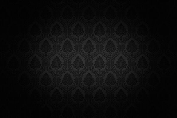 The beam of light is directed at the wall with black wallpaper