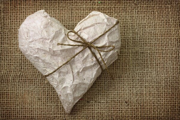 A gift in the form of a heart on burlap