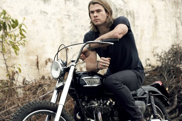 The guy on the motorcycle is a handsome actor