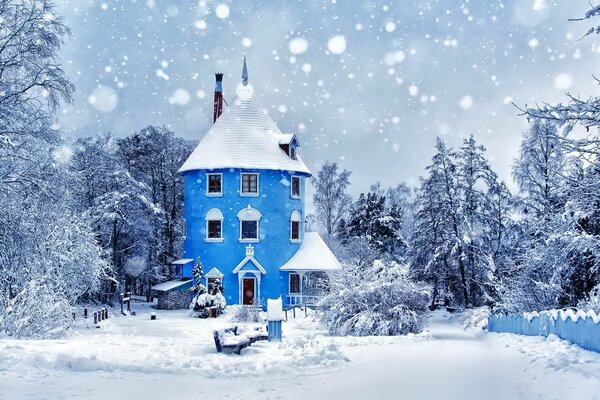 Blue castle on the background of a winter forest