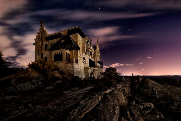 An ancient castle on the background of the night sky