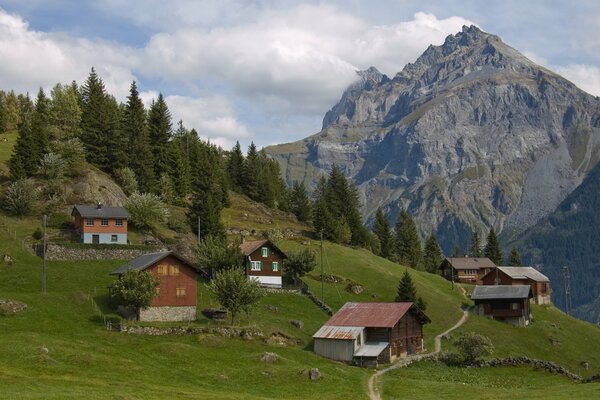 Swiss village on the background of mountains