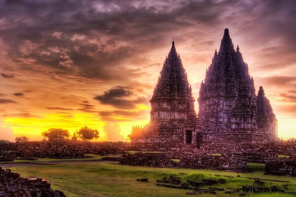 Temple at sunset on the background of clouds