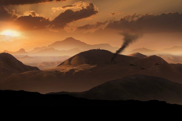 Sunset in the desert. There is a hurricane in the background