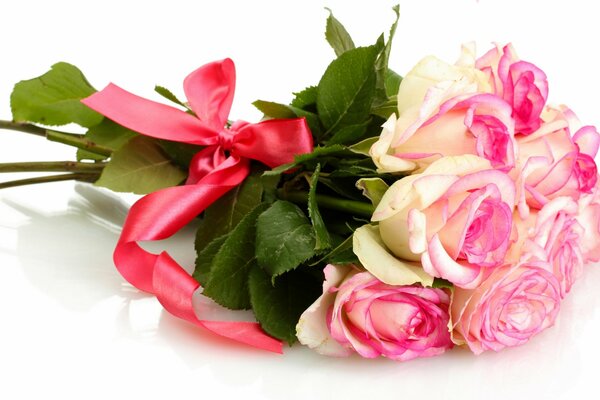 Bouquet of white roses tied with a pink ribbon
