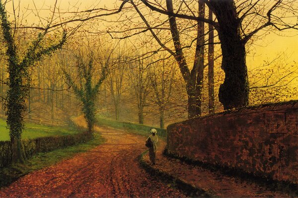 A girl walks down the autumn foliage. Picture