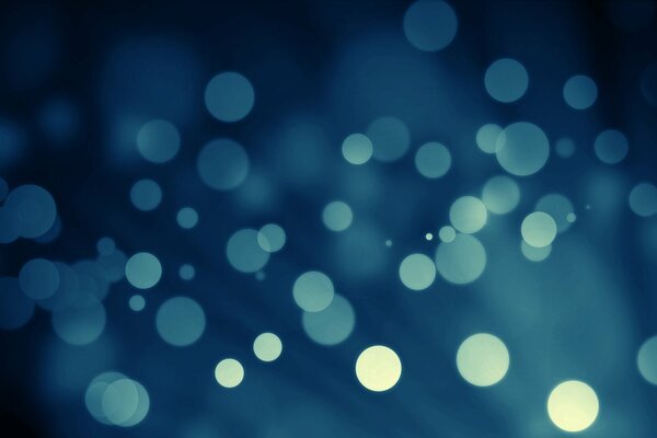 Blue bokeh on a blue background