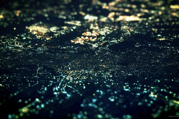 Lights and reflections of the night city in a panoramic photo