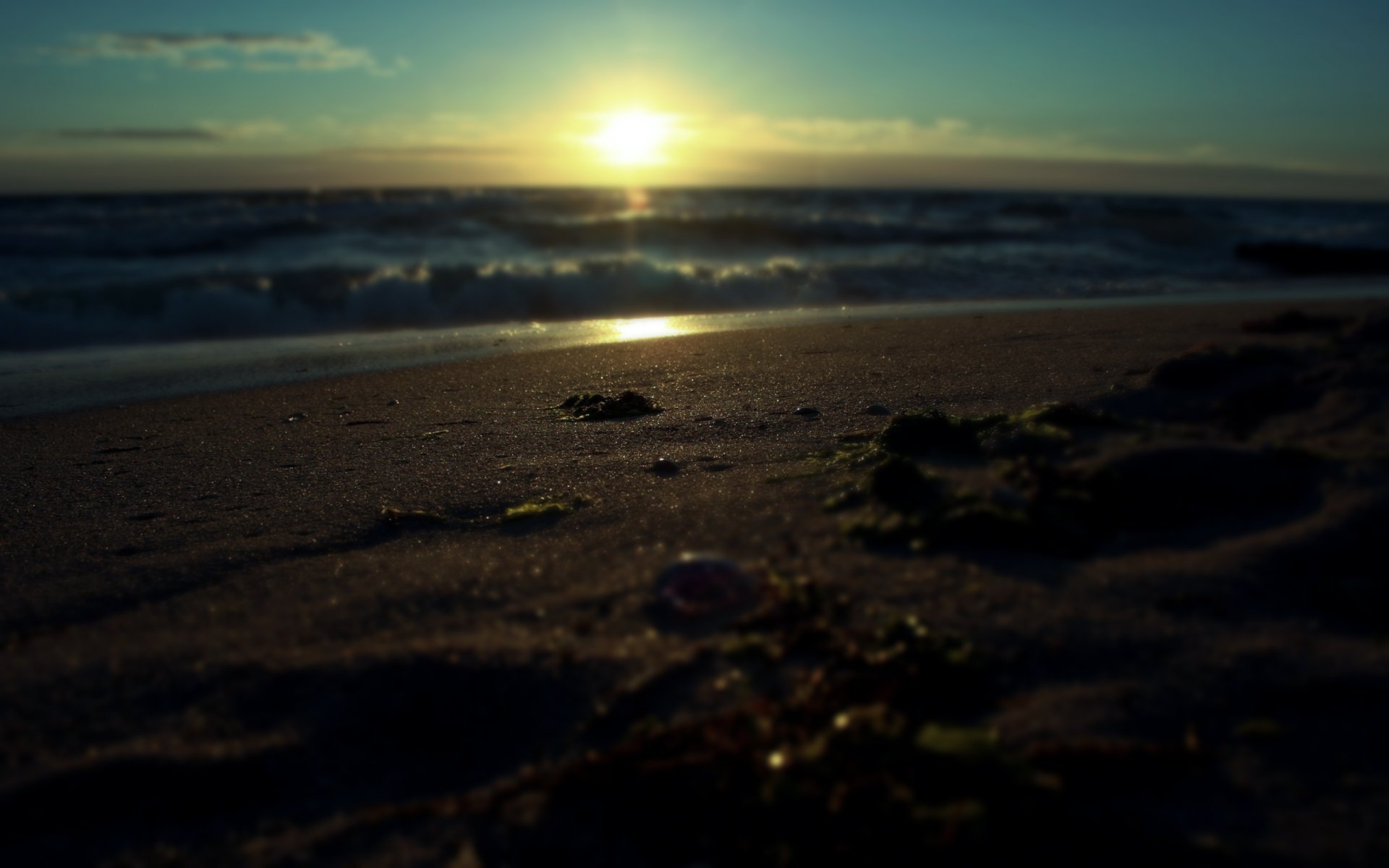 close up macro sand landscape water sea waves sunrise sun ray