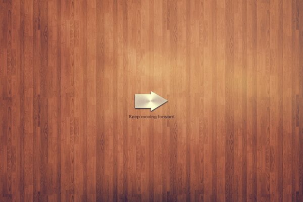 Minimalism. Gray arrow on a brown board