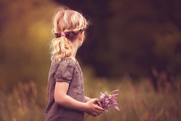 Photo of a girl with flowers in the middle of the forest