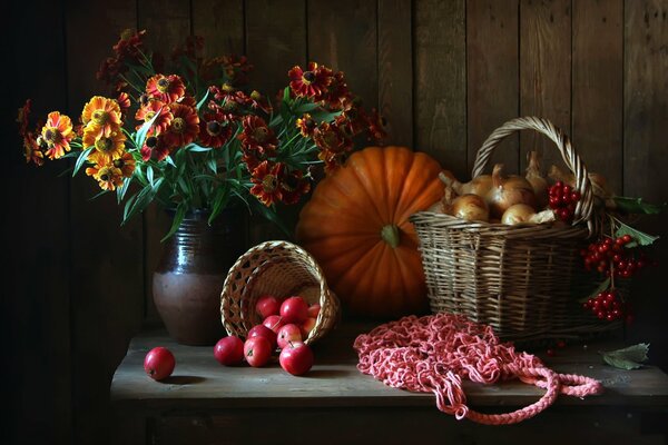 Autumn picture where there are apples and pumpkin