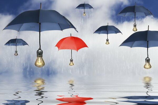 Umbrellas of blue and red colors with a light bulb instead of handles in the rain