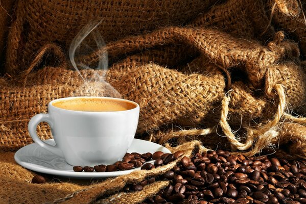 Steaming coffee into cups and coffee beans