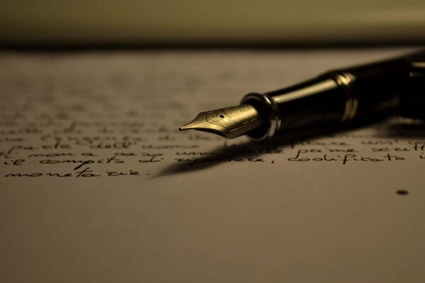 Beautiful pen on a piece of paper with text