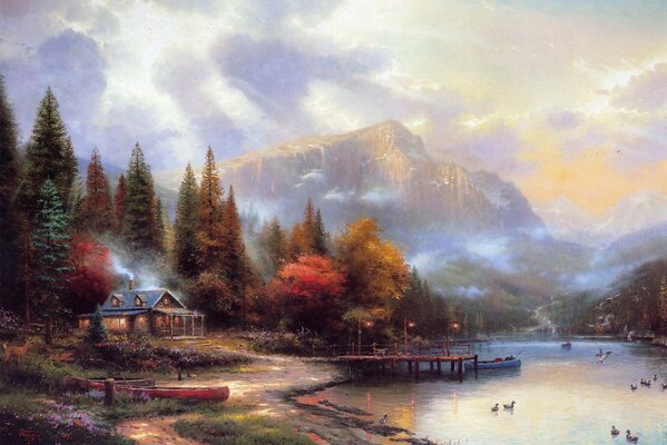 House on the river bank against the background of mountains