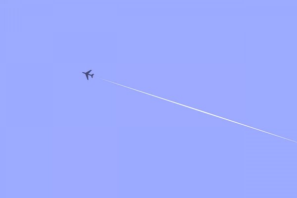 The plane leaves a trail in the sky