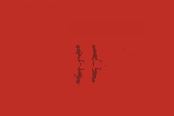 Reflections of silhouettes of running children on a red background