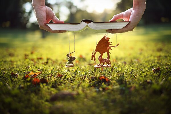 A book with a dragon and a knight
