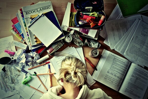 Books notebooks pencils and a girl