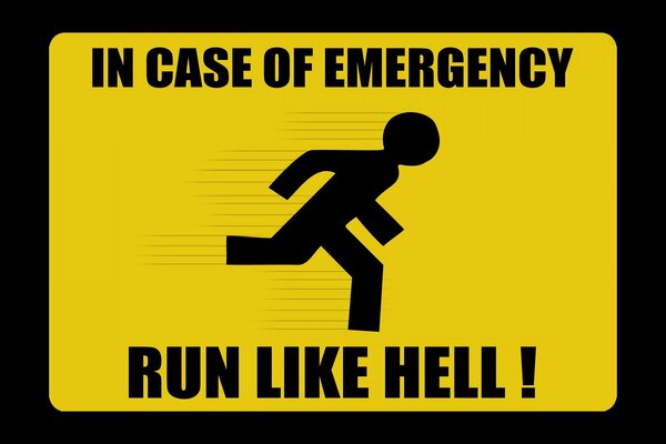 A sign of a running black man on a yellow background and a warning in English what to do in case of danger