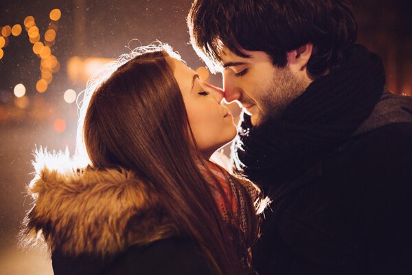 Girl and guy kiss on the street