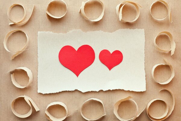 Red hearts on white paper background