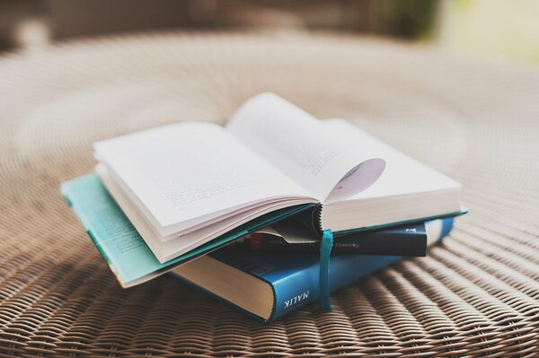 AN OPEN BOOK ON THE TABLE