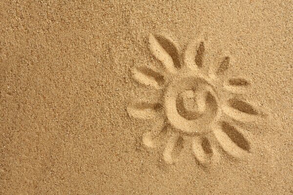 Painted sun on golden sand