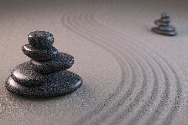 Two pyramids on the sand are separated by grooves