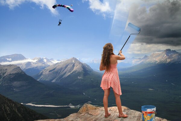 A girl paints the sky with colors