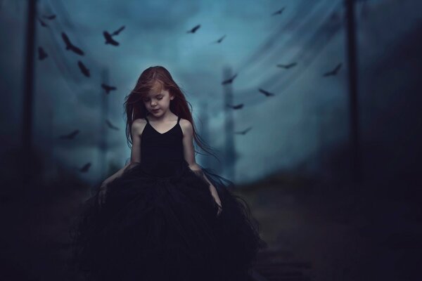 Gloomy photo of a girl in a dress