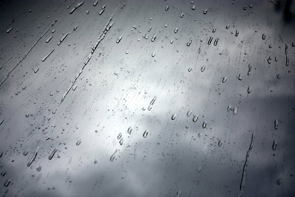 Rain behind the glass in black and white