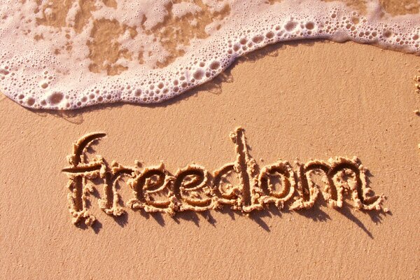 Inscription on the sand near the sea