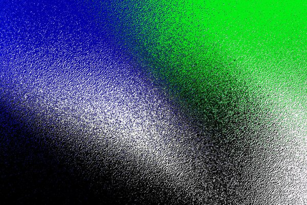 The background is splattered with multicolored paints