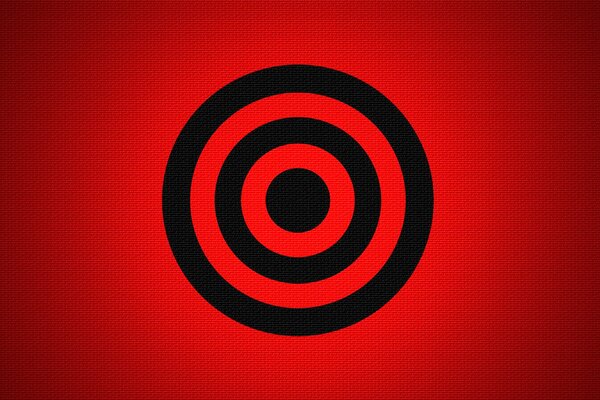A black target on a red background