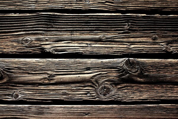 Old wooden covering in black and brown colors