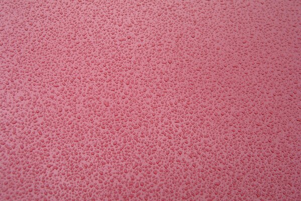 Beautiful textured pink background with drops