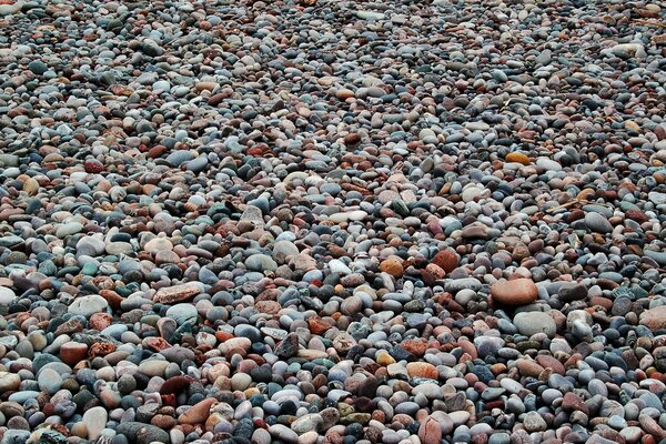 A lot of small stones on the beach in the village
