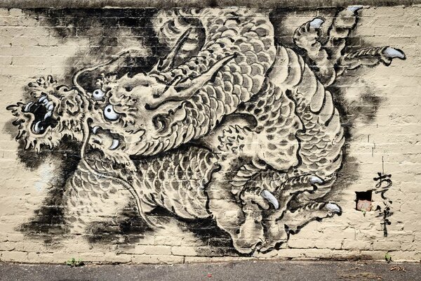Graffiti dragon on a light wall