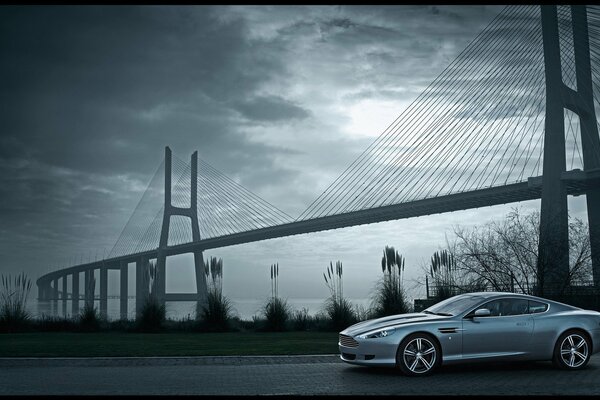 Aston martin stopped near the bridge