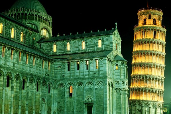 Amazing night illumination of the Leaning Tower of Pisa and other attractions