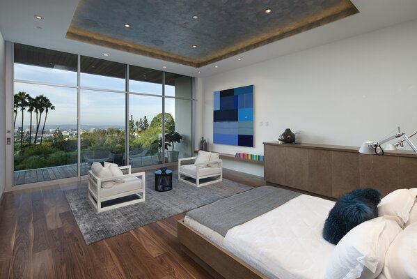 Interior design of a terrace with floor-to-ceiling windows
