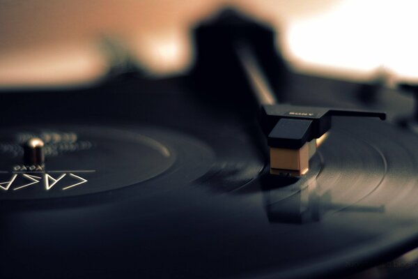 A vinyl record plays music