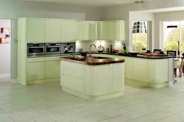 Stylish kitchen in light green tones