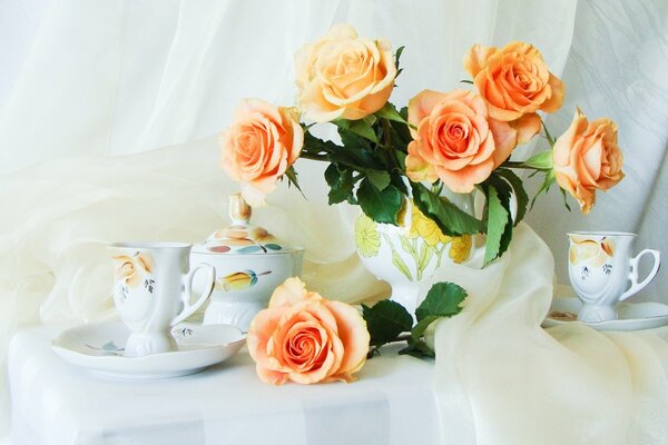 Still life with tea roses and tea set