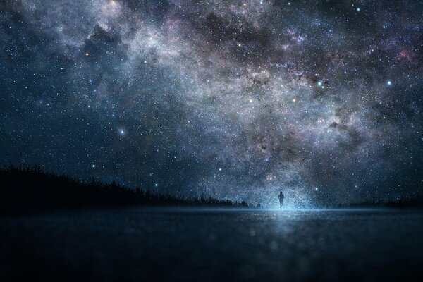 The shadow of a guy on the background of the sky with the Milky Way