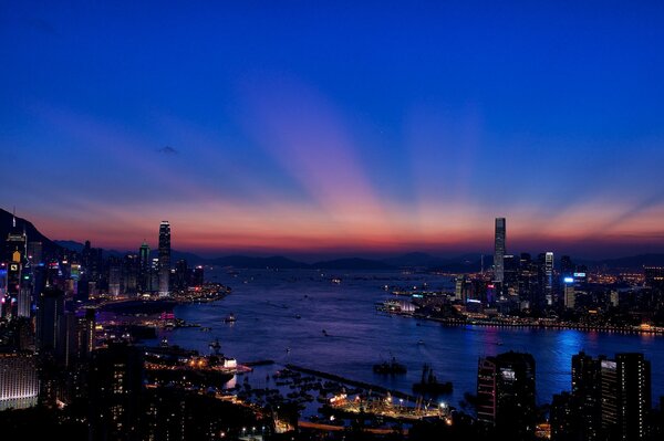 Glowing night city at sunset